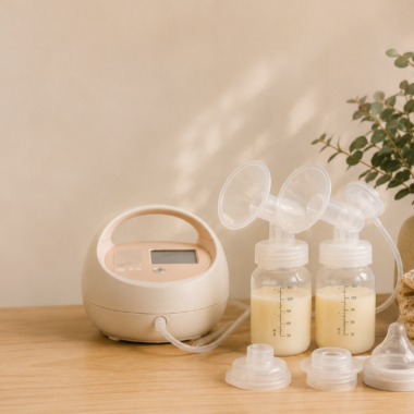 Breast pump with two bottles of expressed milk and folded cloths